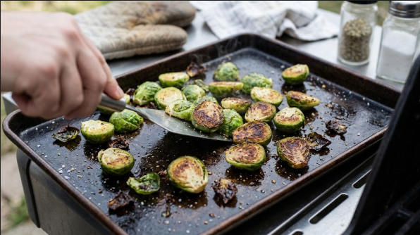  Sprouts on the sheet pan at the halfway flip, showing browned cut sides