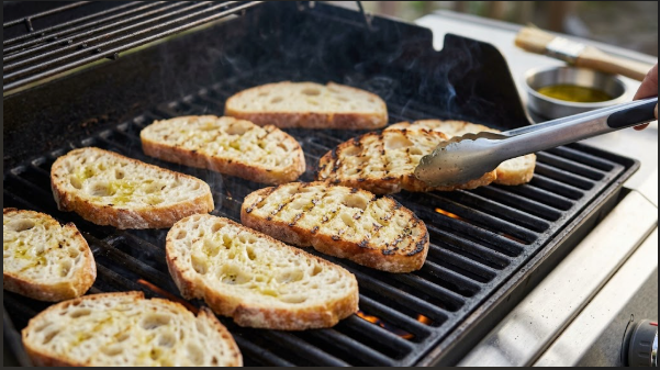 Oiled bread slices on hot grates showing the first set of char marks