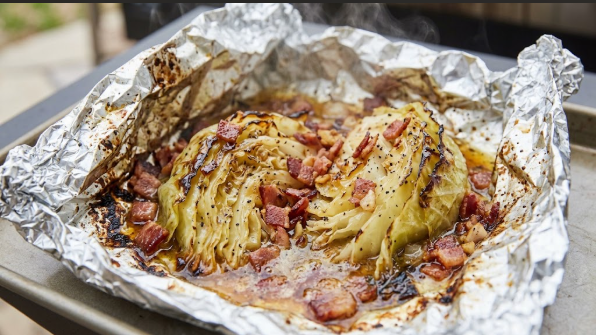  Opened foil packet showing butter, bacon, and glossy tender cabbage