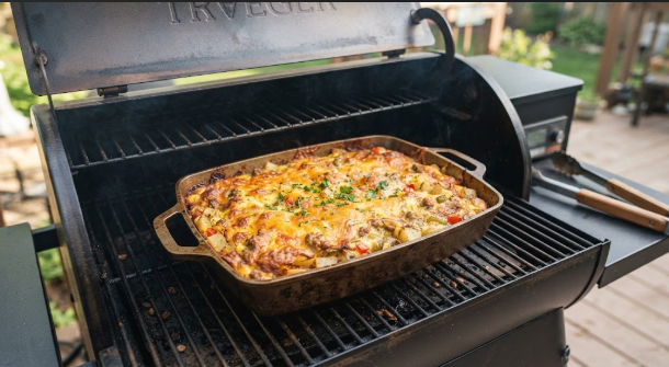 Golden breakfast casserole in a pan on a pellet grill