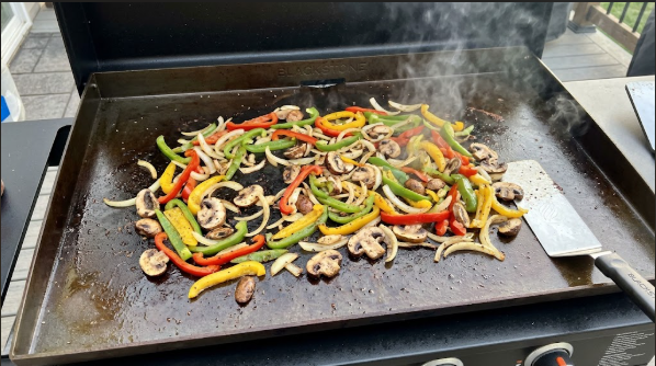 Colorful veggie skewers on a hot grill with visible char marks