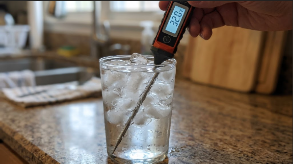  Instant-read thermometer in an ice water glass showing 32°F