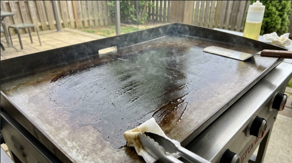  A freshly seasoned Blackstone top turning from silver-gray to deep brown after the third layer